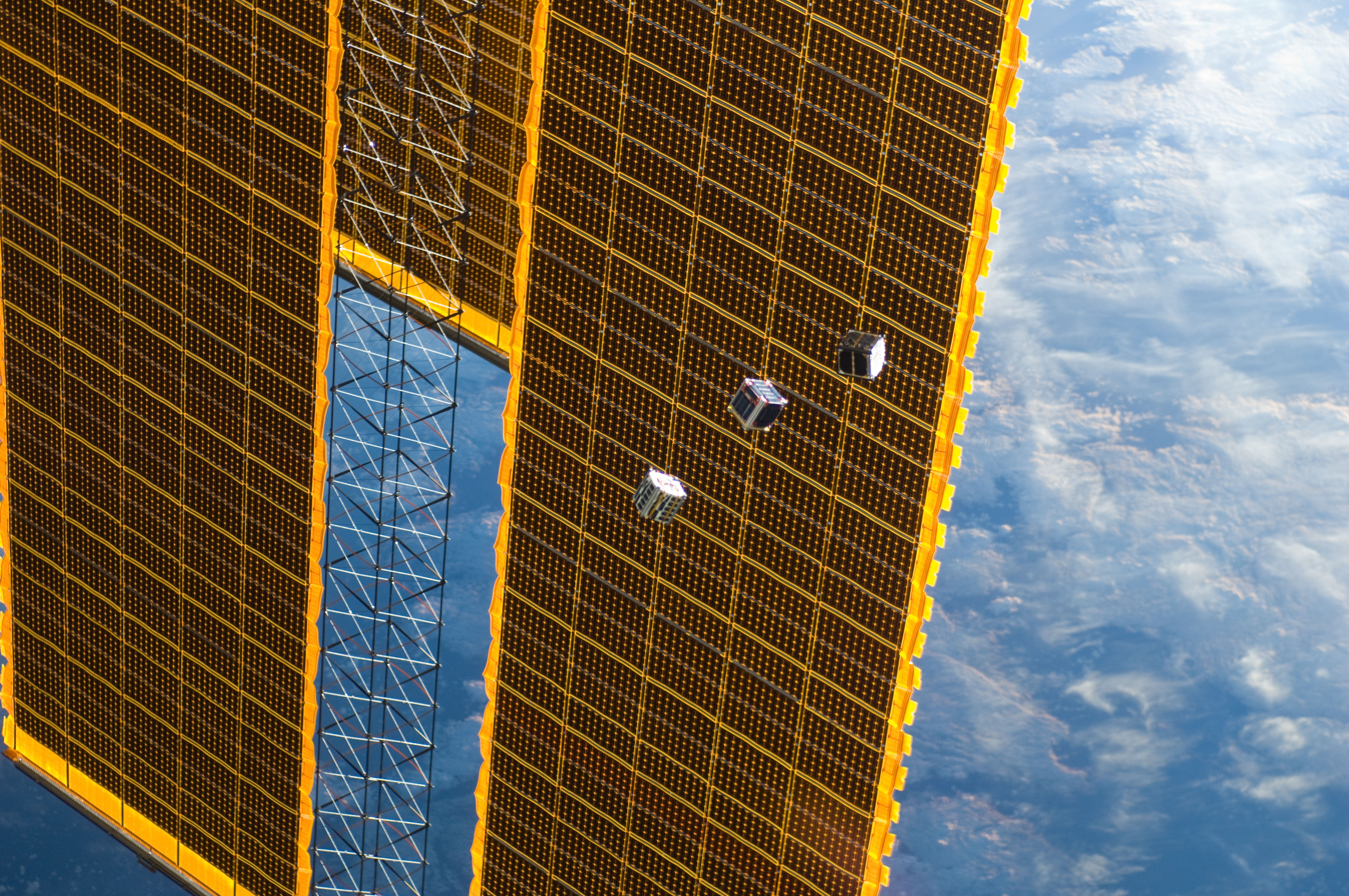 Amateur Radio CubeSats TechEdSat, F-1 and FITSAT-1 pass the ISS solar panels