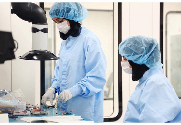 Hessa Ali and Maitha Al Shizawi verifying the Nayif-1 hardware as well as conducting electrical and functional tests