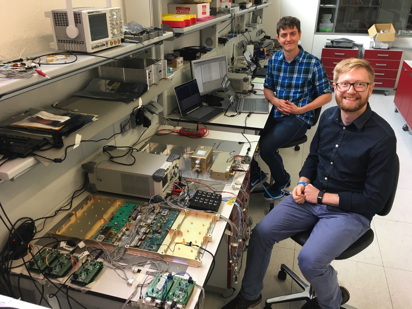 Dr Chris Bridges M0IEB and Pete Bartram from Surrey Space Centre with the AMSAT-UK payload and some of the ESEO electronics