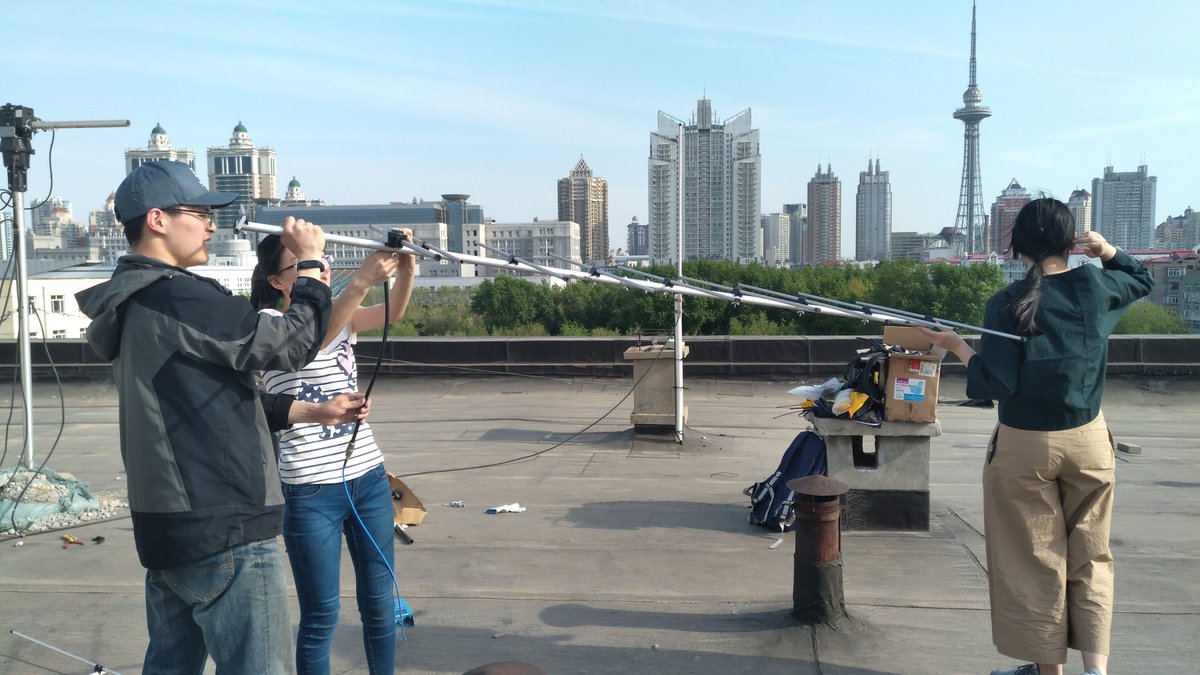 Students installing antennas at BY2HIT