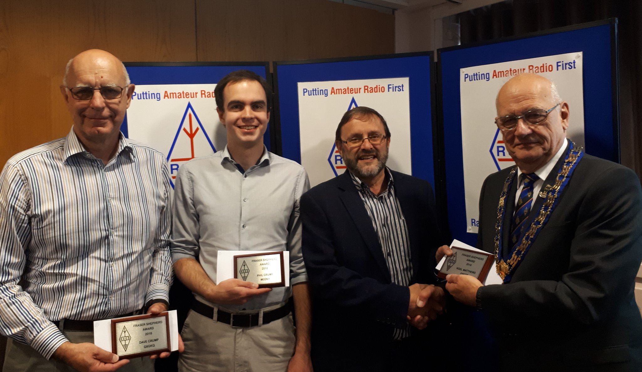 Dave Crump G8GKQ, Phil Crump M0DNY and Noel Matthews G8GTZ receive award from RSGB President Dave Wilson M0OBW - image credit RSGB